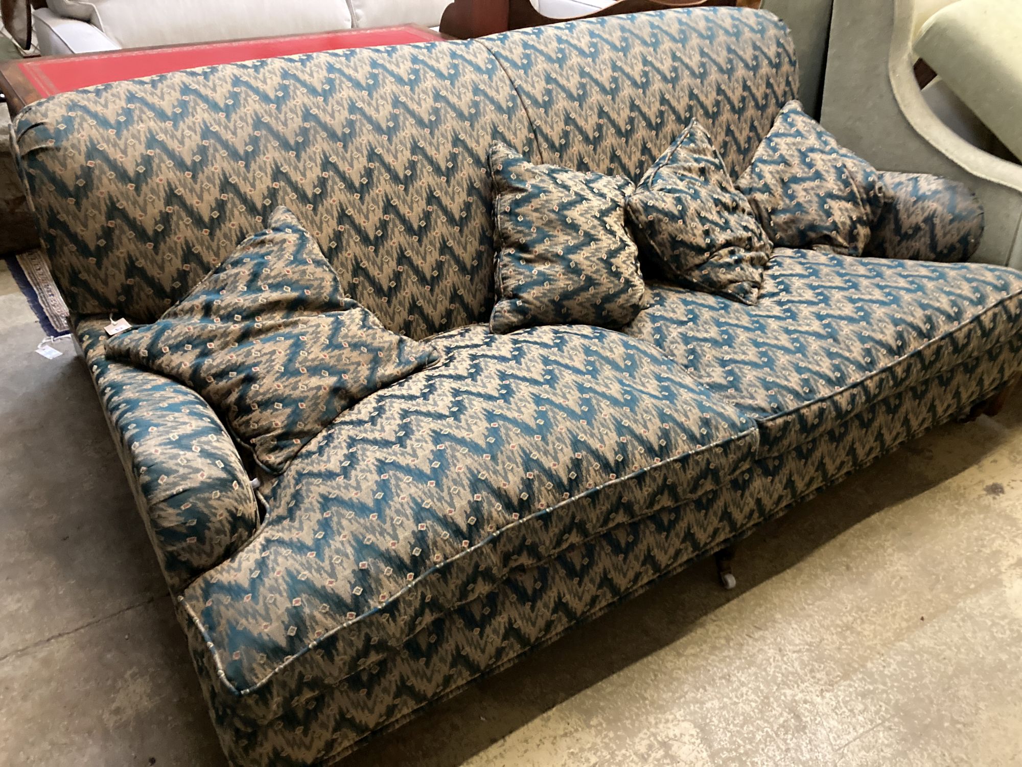 A contemporary Howard style upholstered two seater settee, length 186cm, width 94cm, height 80cm